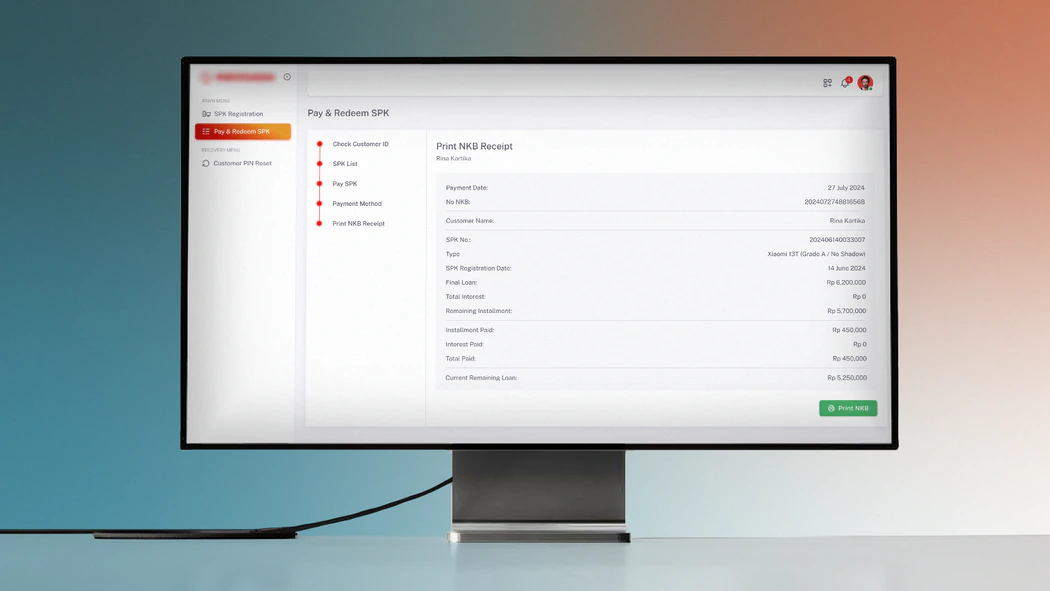 The pawnshop system on a desktop monitor: the Pay & Redeem SPK screen at its last step, printing the NKB receipt with the customer's loan and payment summary.