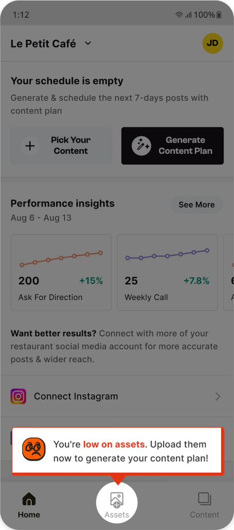 The home screen dimmed behind a “You're low on assets” reminder that points to the Assets tab.